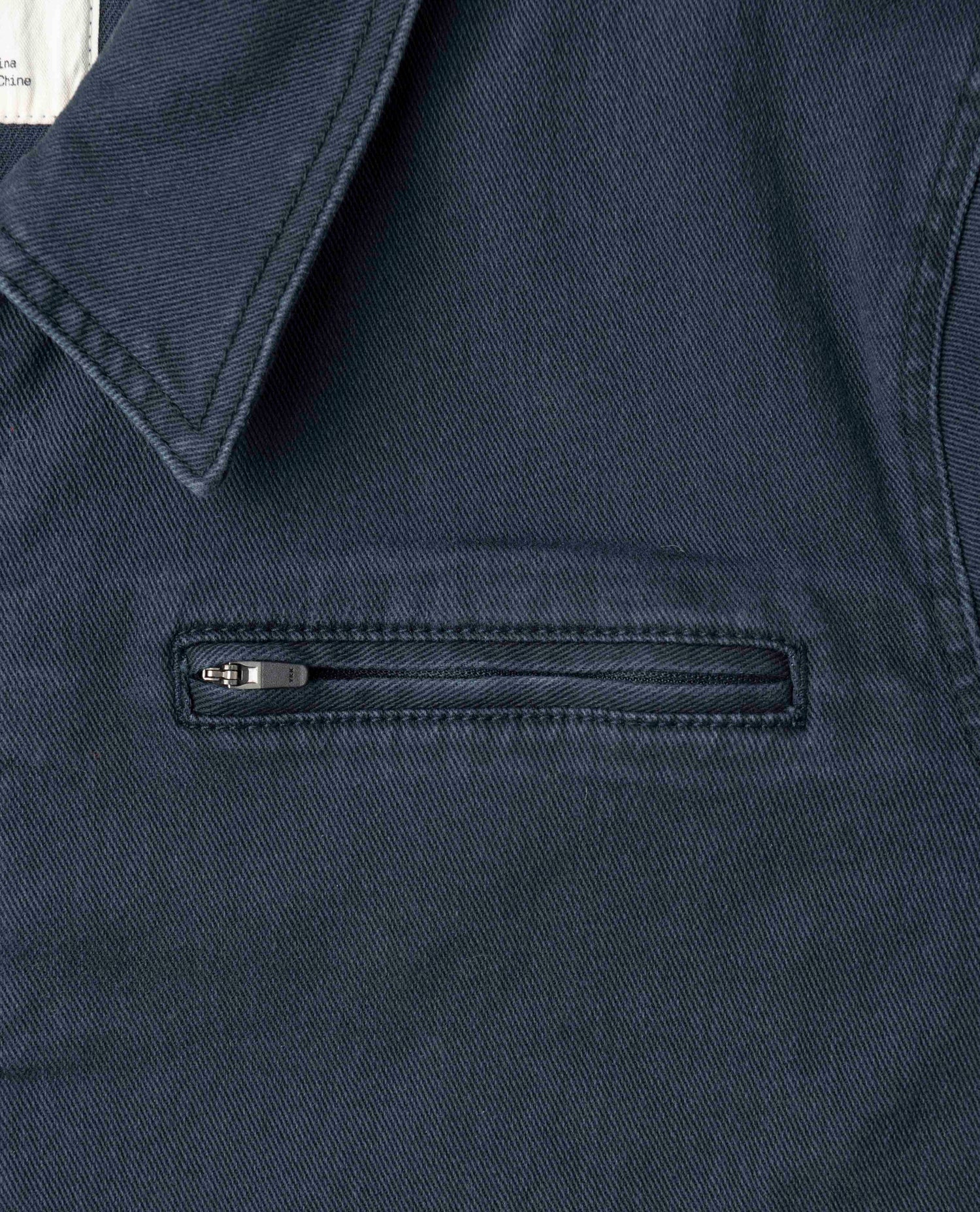 A close up of the front left pocket on a Ripton Sport Utility jacket in Navy. 