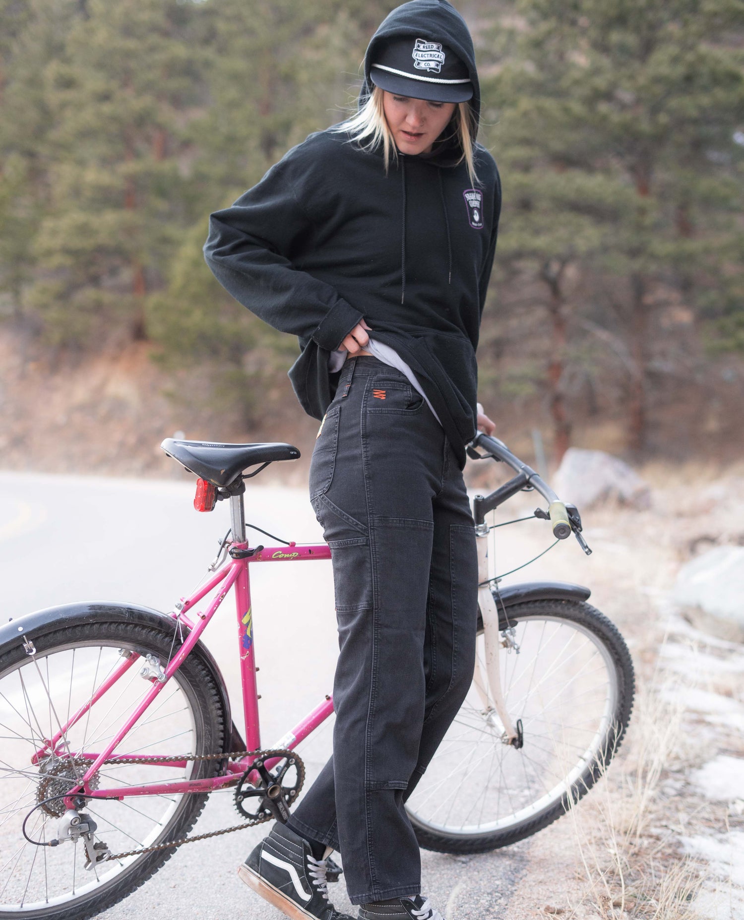 Mo wearing Women's Superlite Utility Jeans with a vintage bike