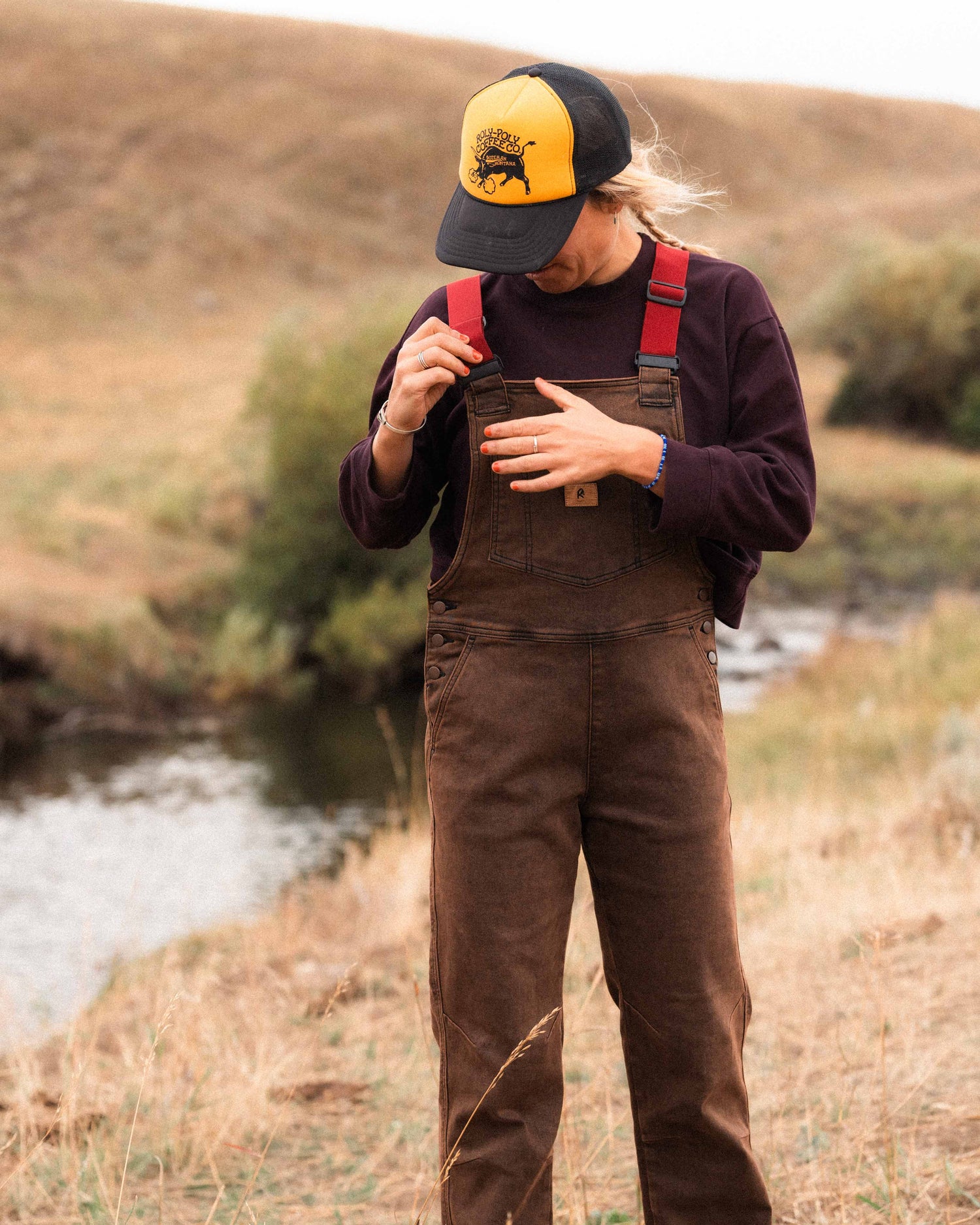 Girl wearing rust overalls in Montana