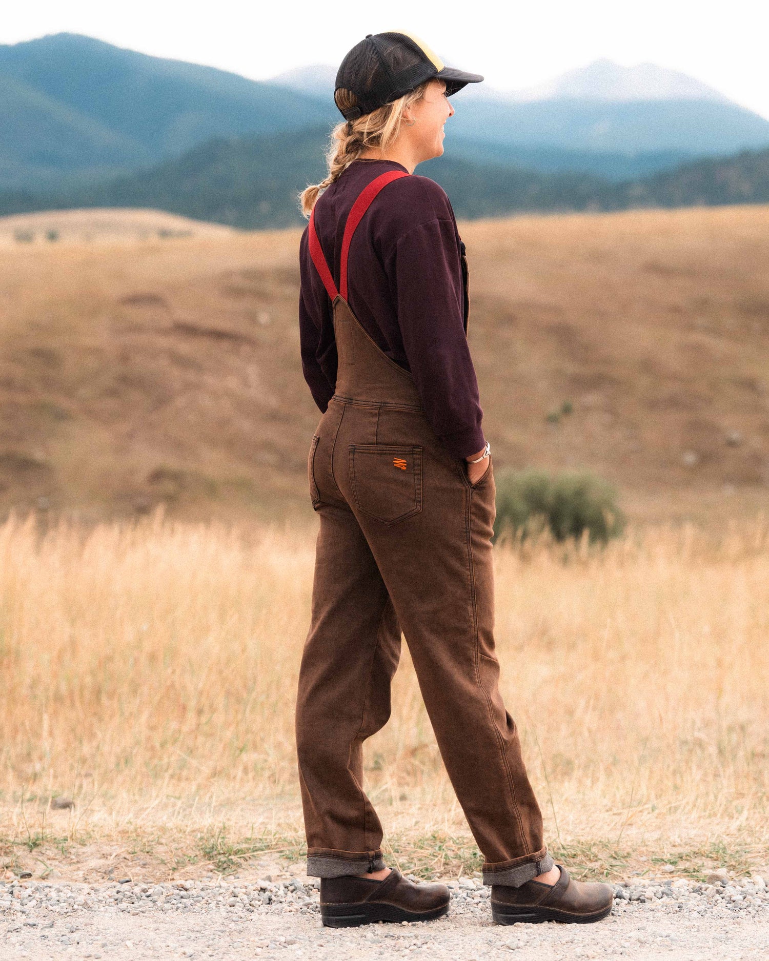 Girl wearing rust overalls in Montana