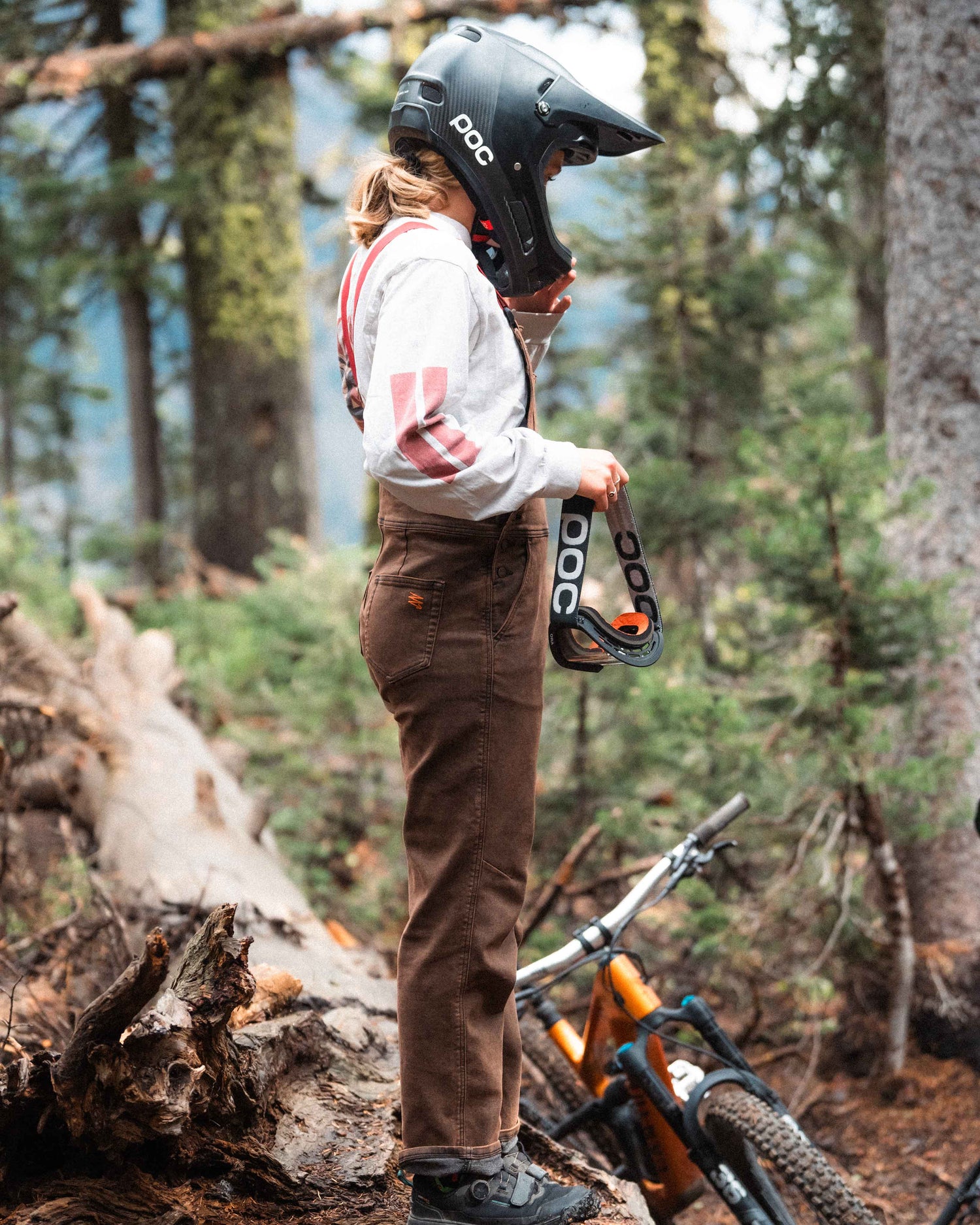 Jazlyn wearing rust overalls on the trail