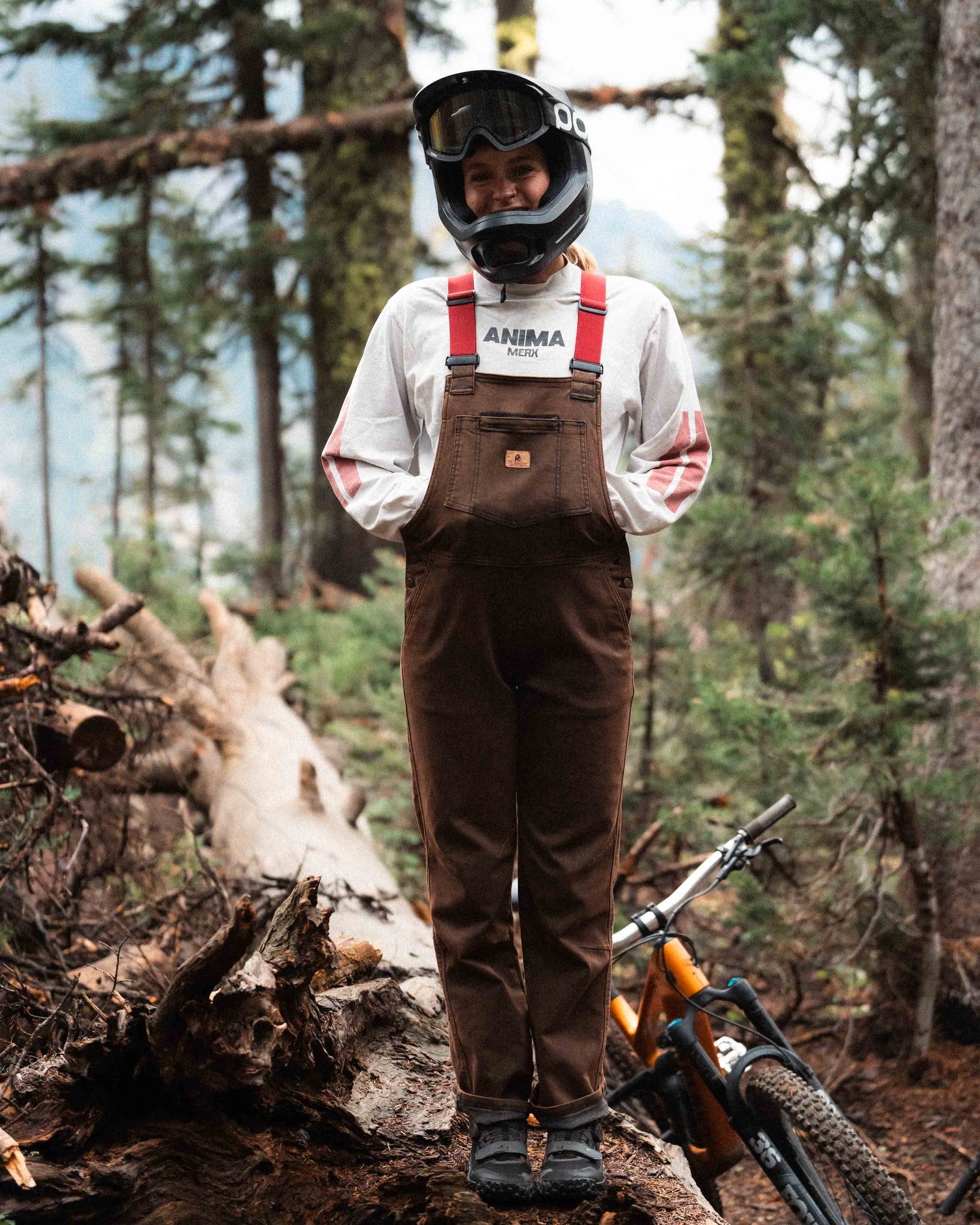 Jazlyn wearing rust overalls on the trail