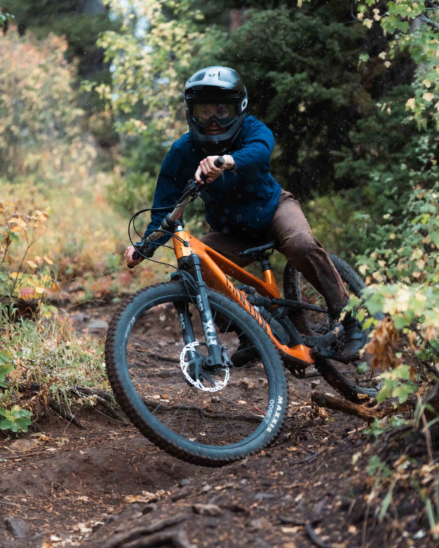 Jazlyn riding mountain bikes in overalls