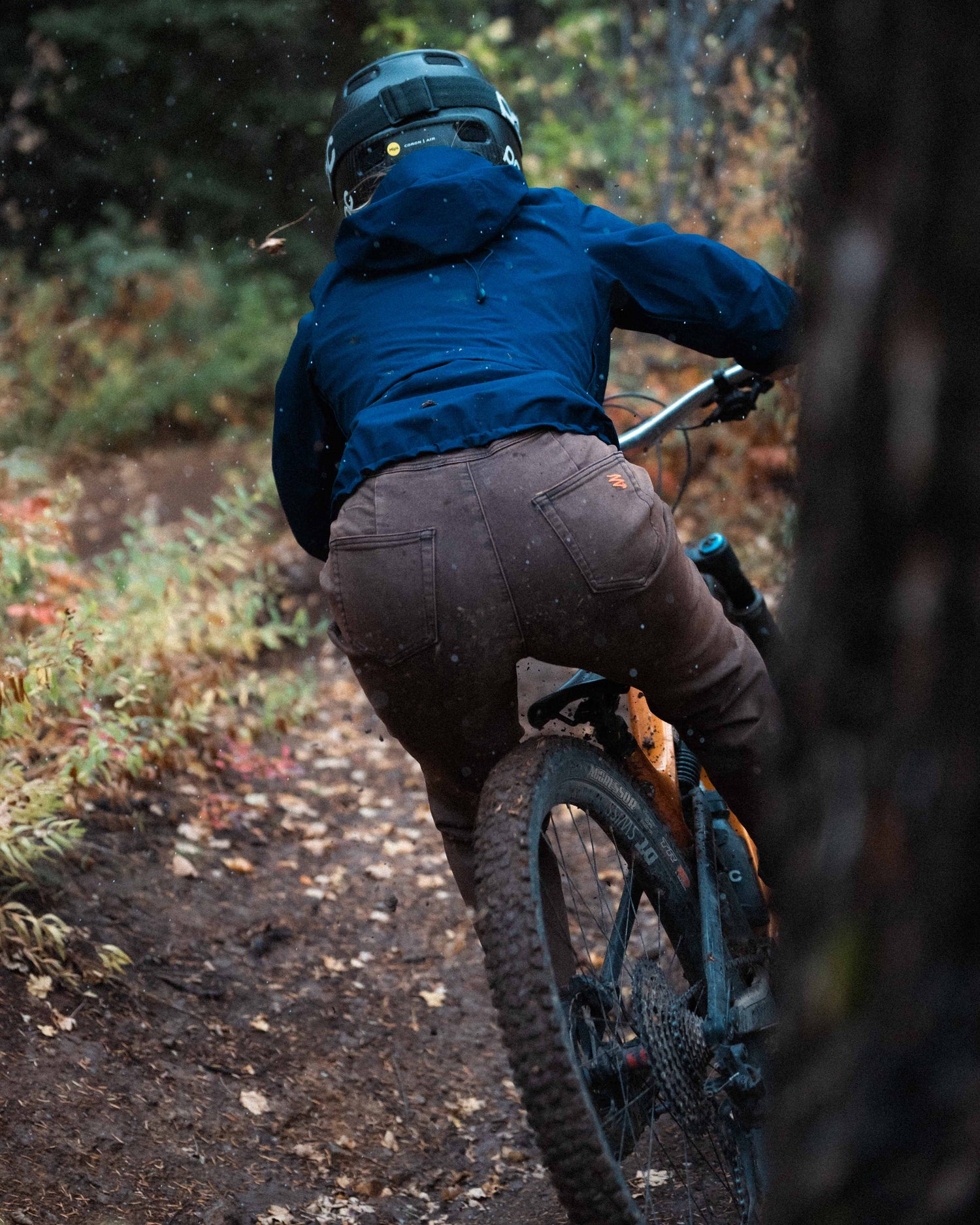 Jazlyn riding downhill on MTB