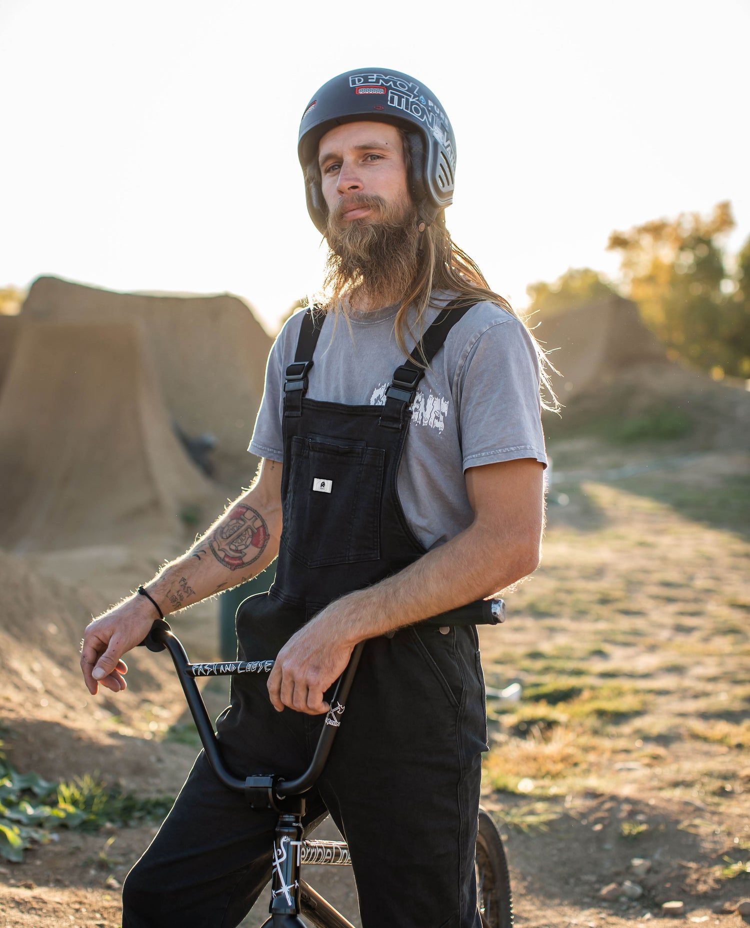 Man standing in his Diesel Overalls. 