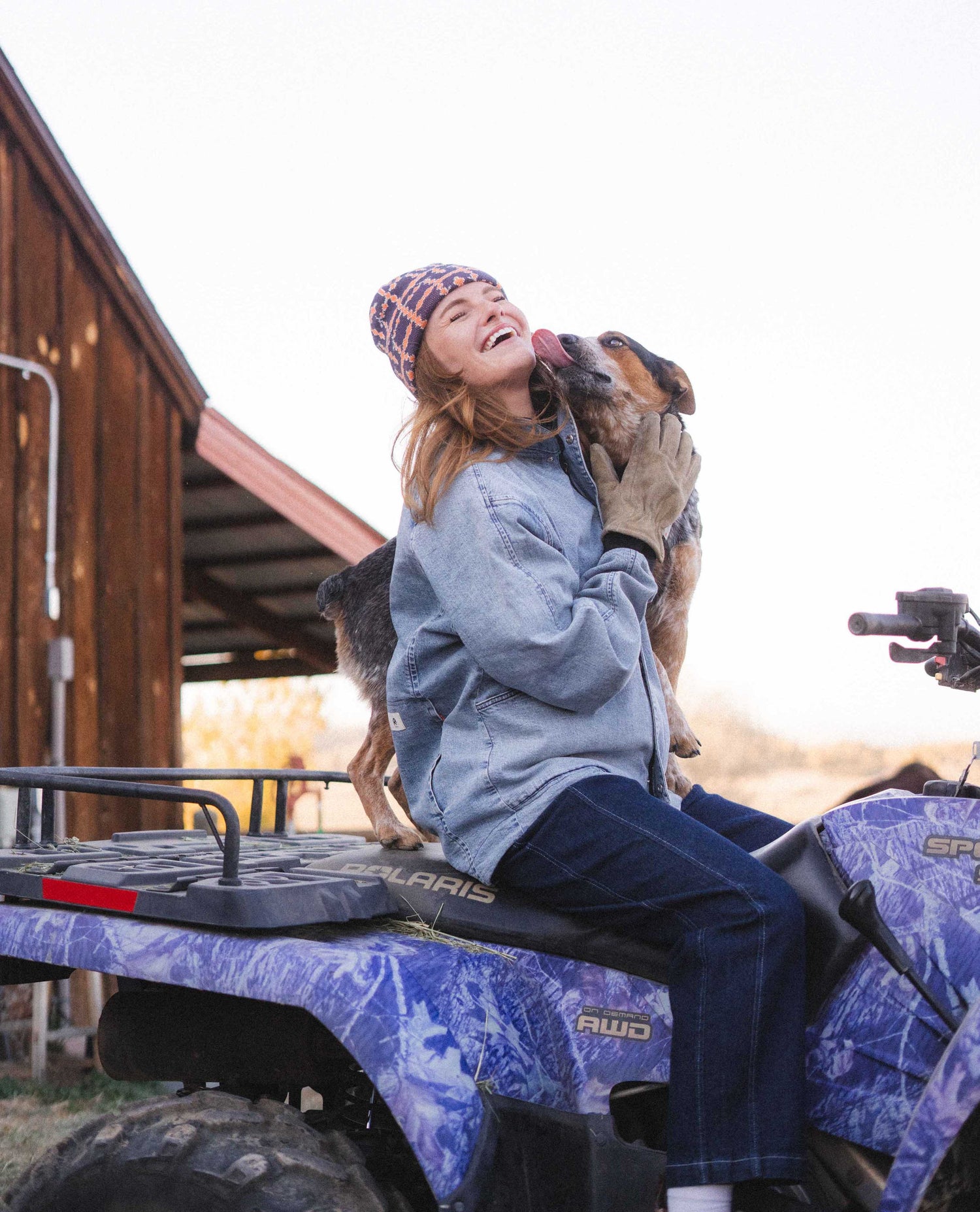 Woman sitting on an ATV in a Ripton GT Reverso jacket.