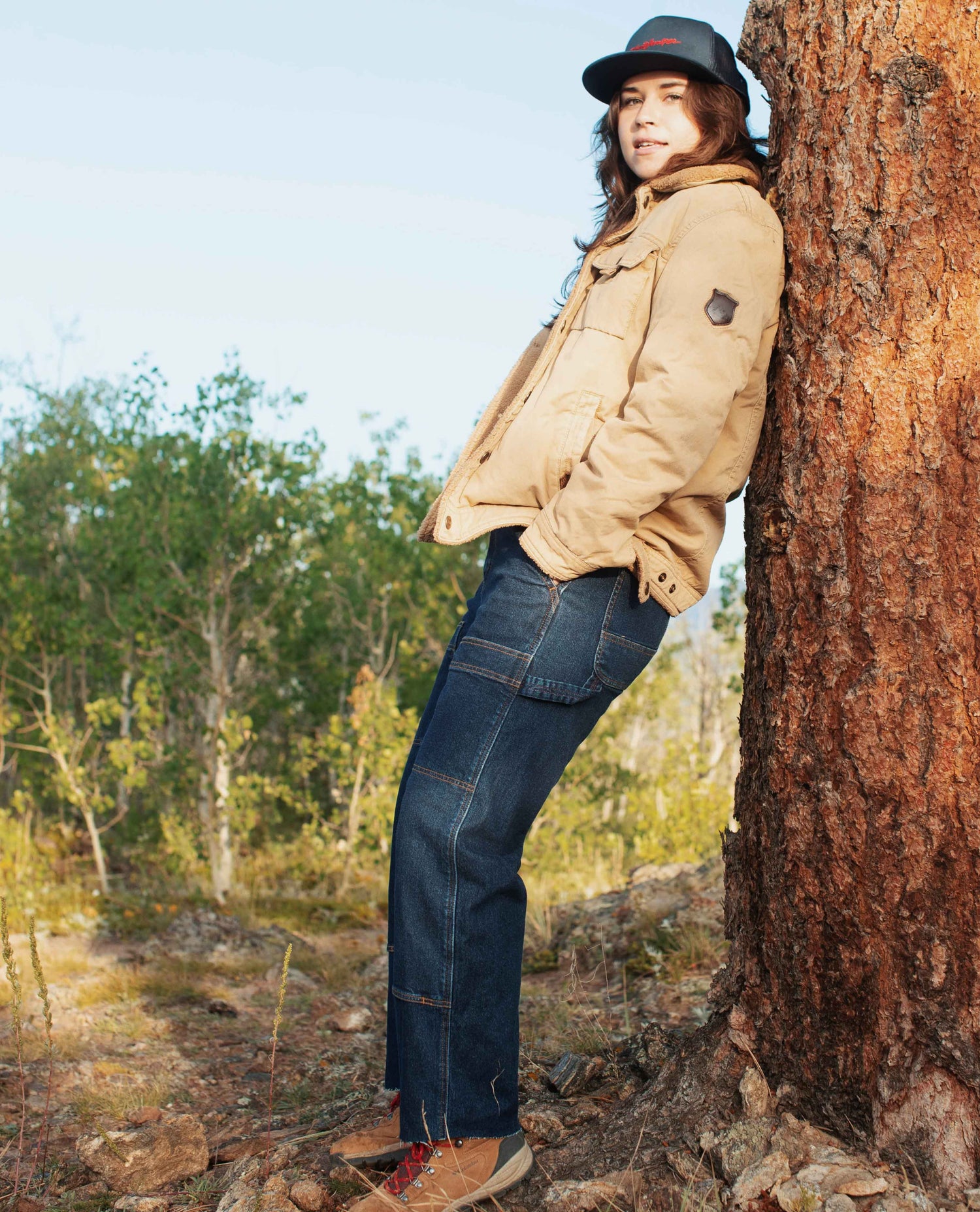 Woman standing in Blue Collar Sport Utility Jeans.