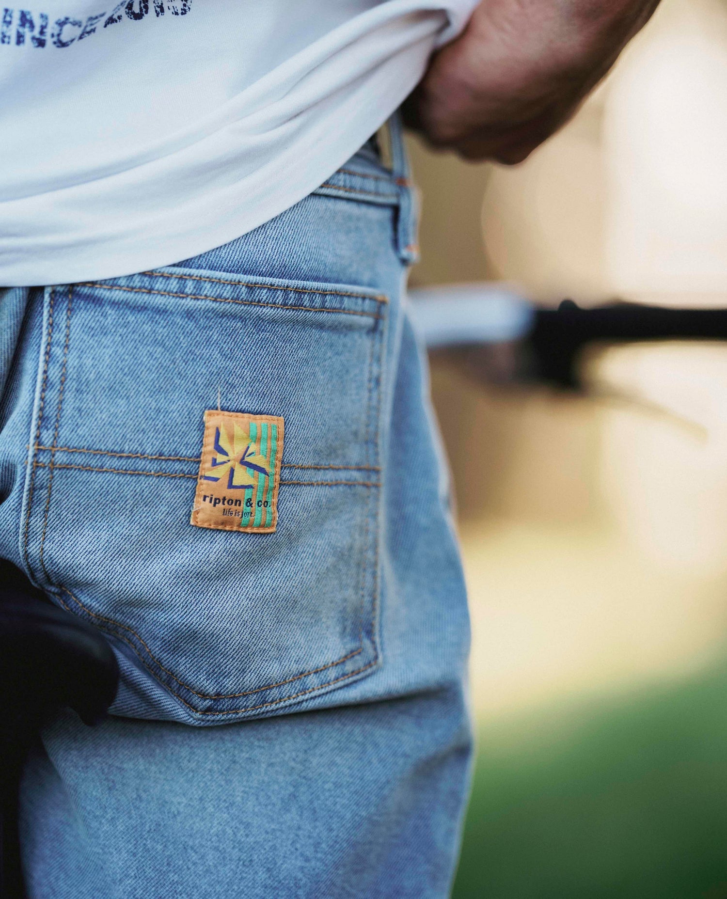 A close up of the Ripton and Co tag on a pair of jorts. 