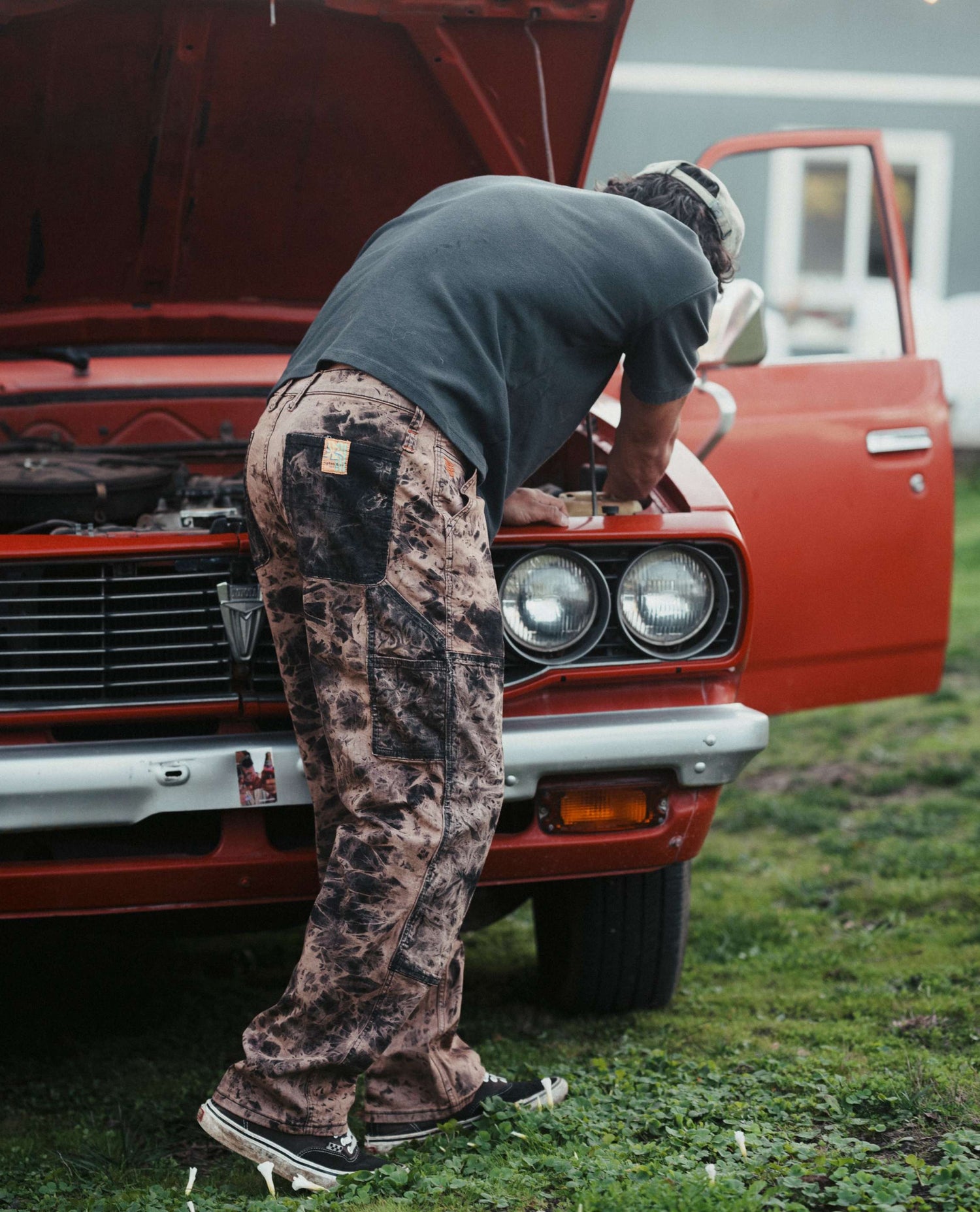 Isaac working on his red truck