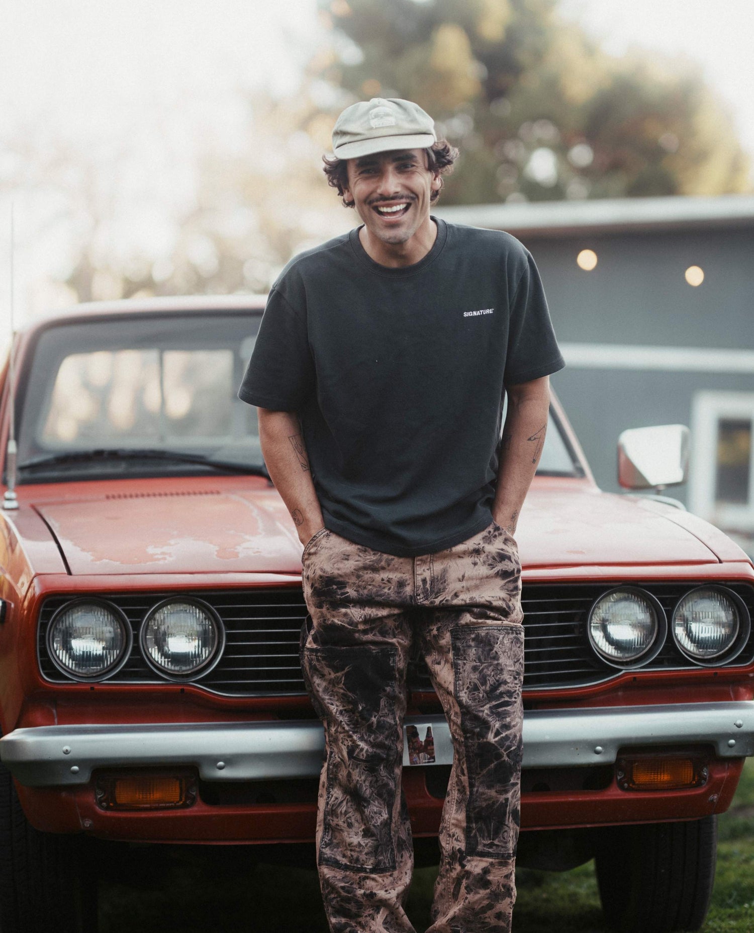 Isaac standing in front of his truck