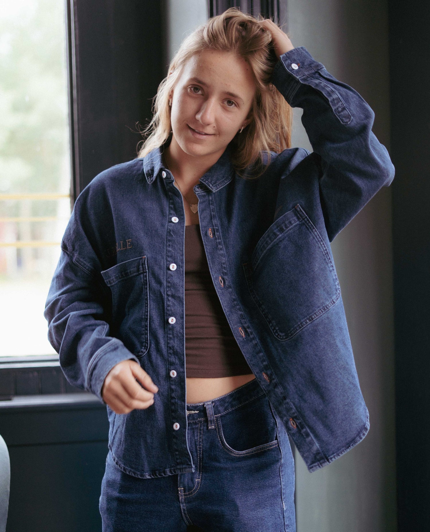 Janelle looking cool in a denim shirt
