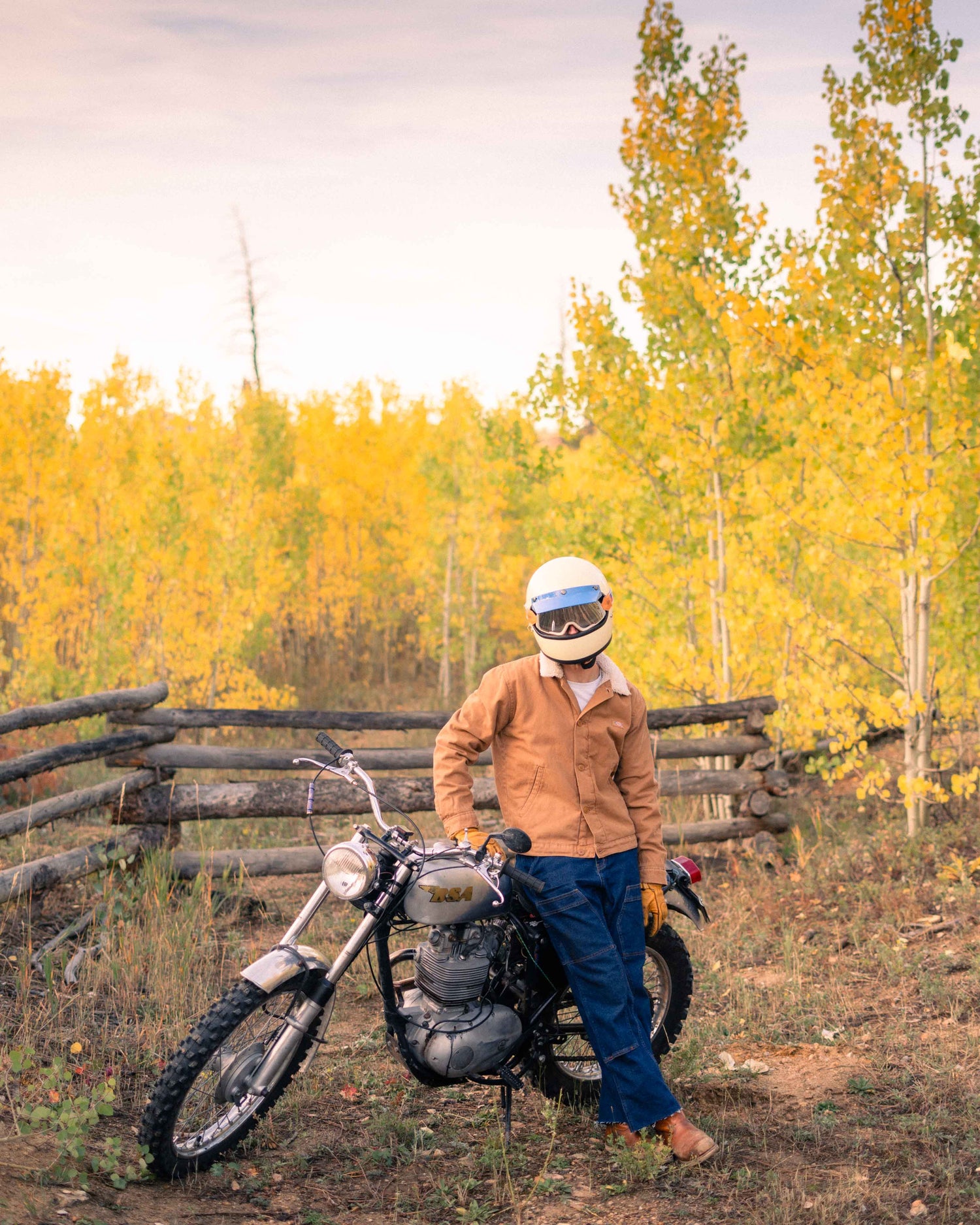 Some guy on a motorcycle wearing jeans