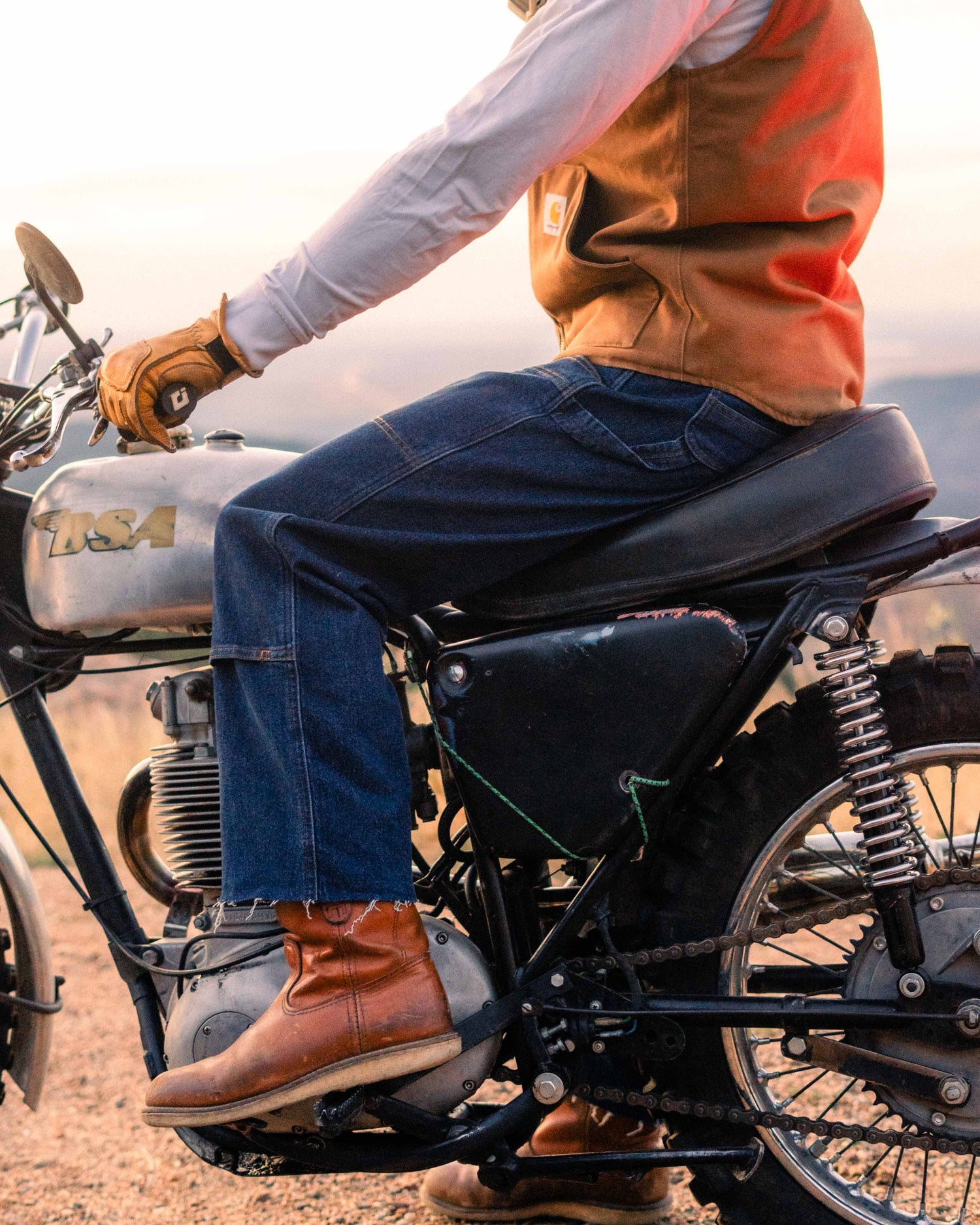 Guy sitting on a motorcycle in jeans