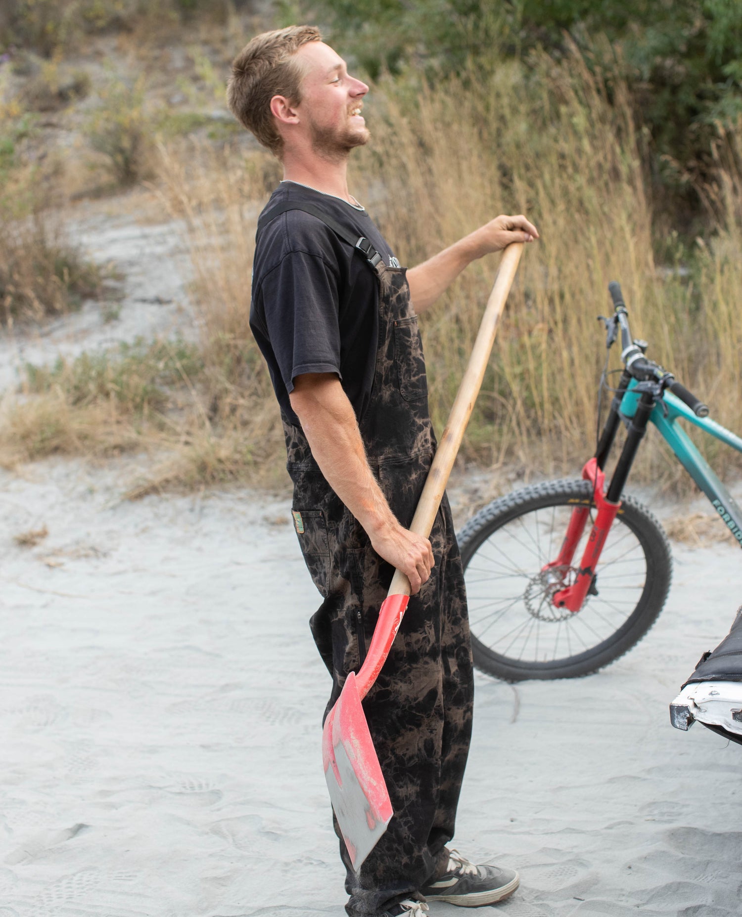 Billy with a shovel in Hello Buddy Overalls