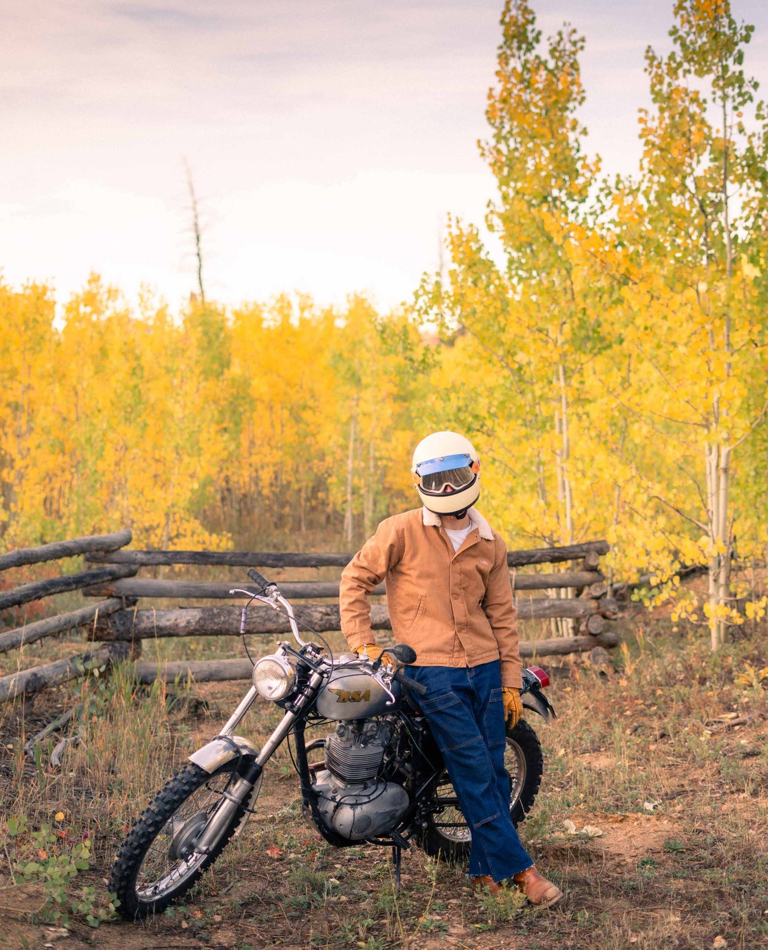 Man sitting on a motorcycle in jeans. 
