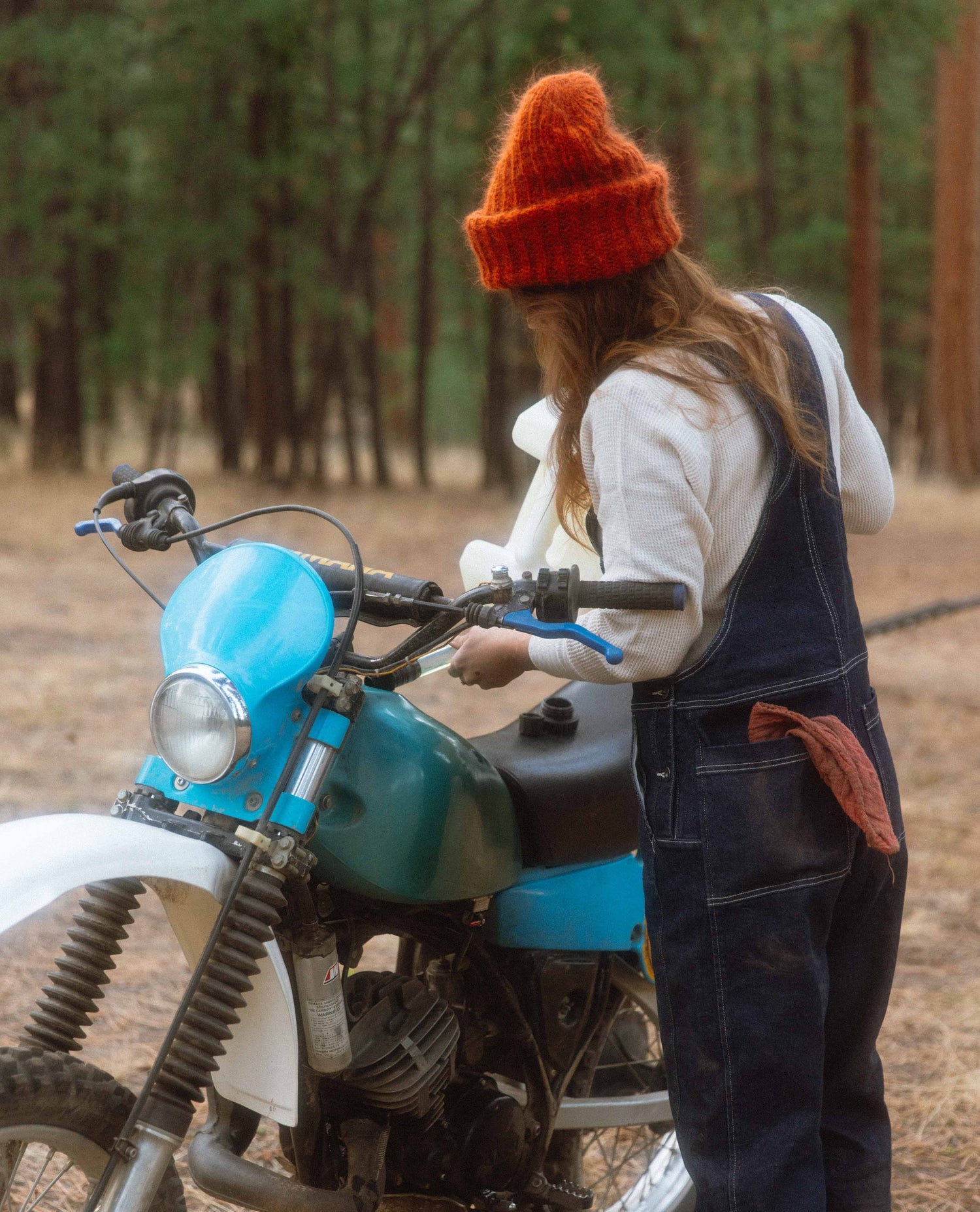 Alex wearing Starving Jartist Overalls with moto