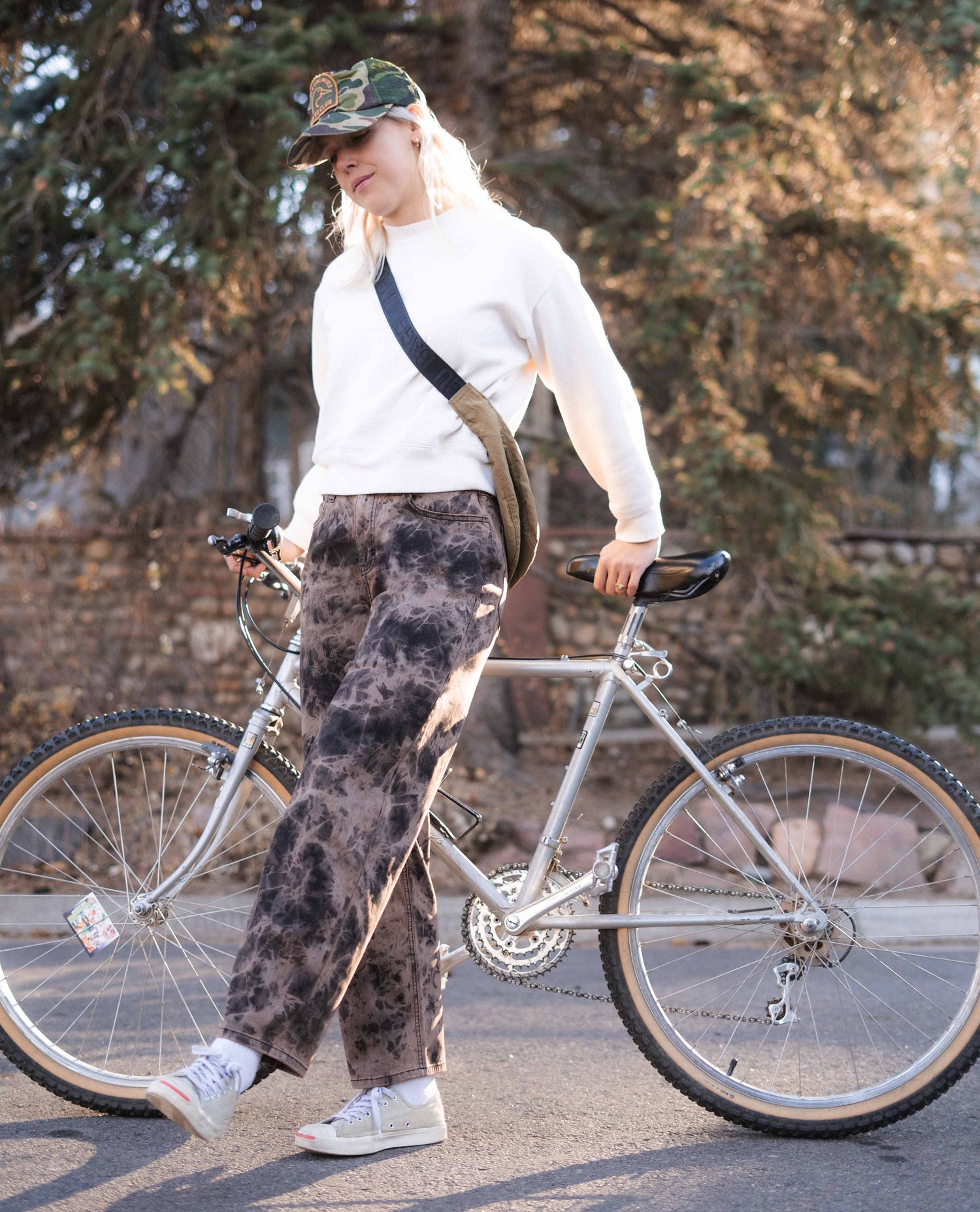 Woman with bike wearing Superlite Wide in Nuts wash