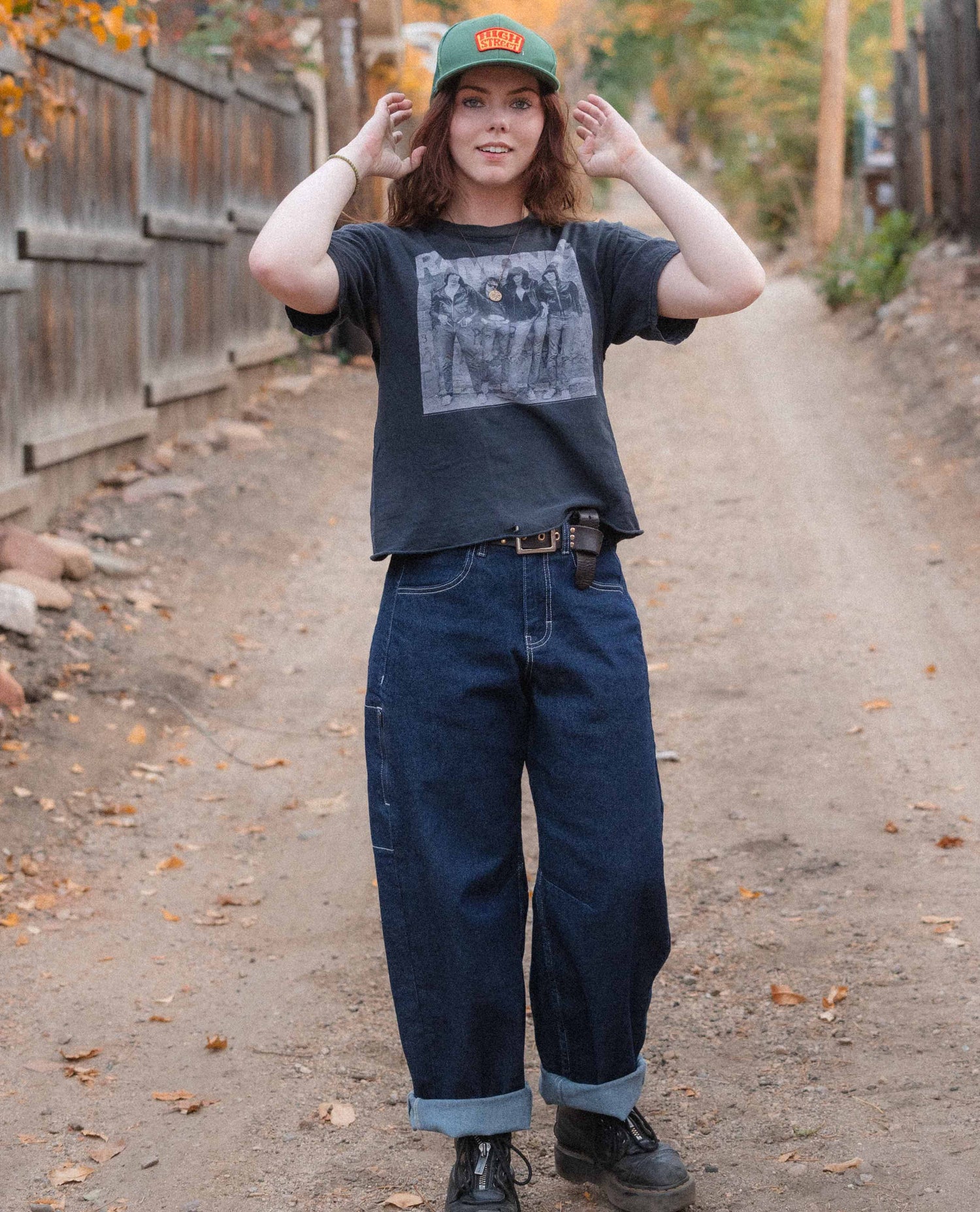 Woman standing in an alleyway in her Ripton Tuxedo Jantalones.