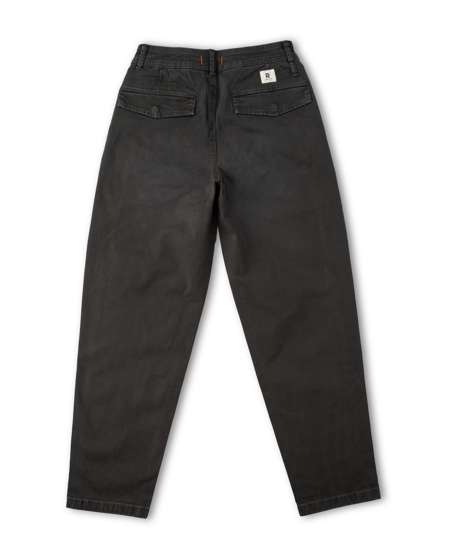 A pair of dark gray washed denim pants shown from the back, featuring a small white Ripton brand patch on the upper right back waist, set against a plain white background.
