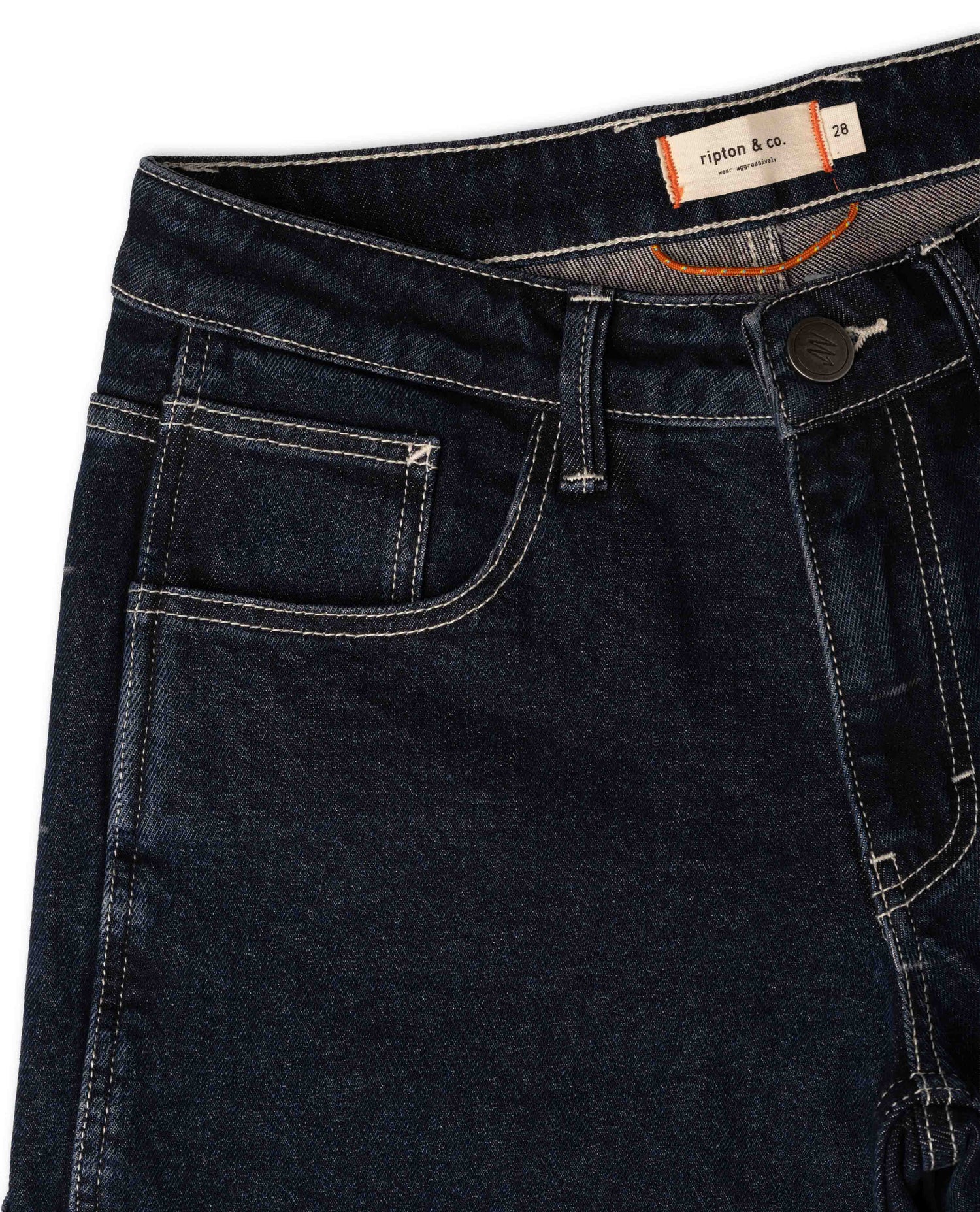 Dark blue jeans with a brand label on the waistband against a white background