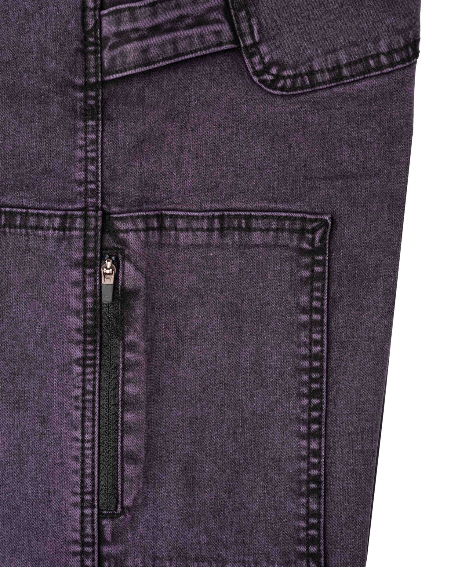 Close-up of a dark gray denim pocket with stitching detail.