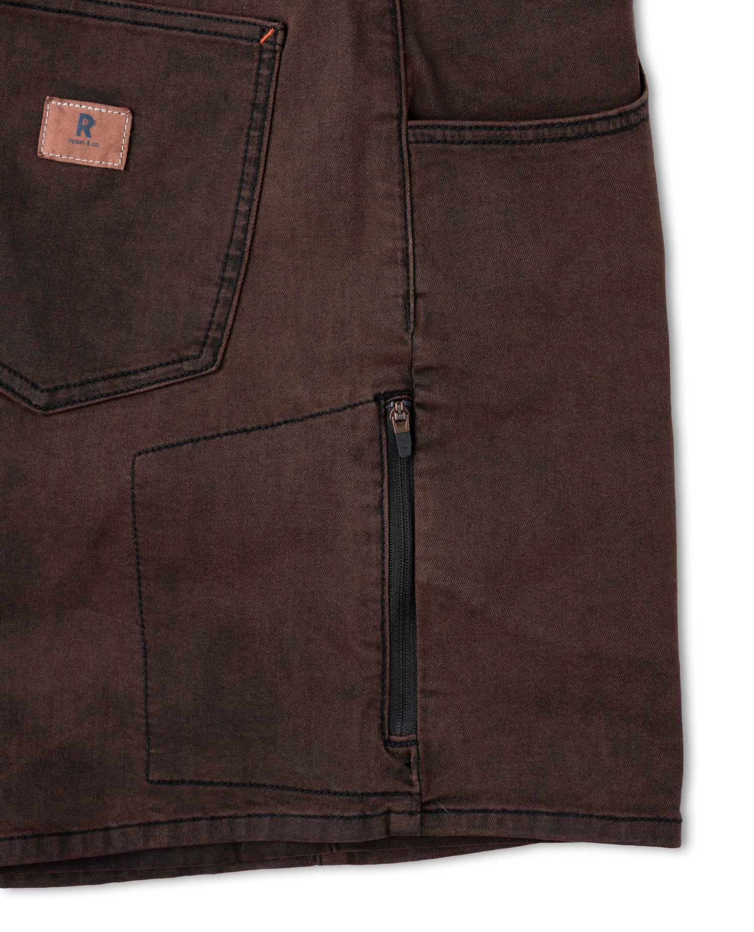 Brown pants with a visible brand logo on a white background