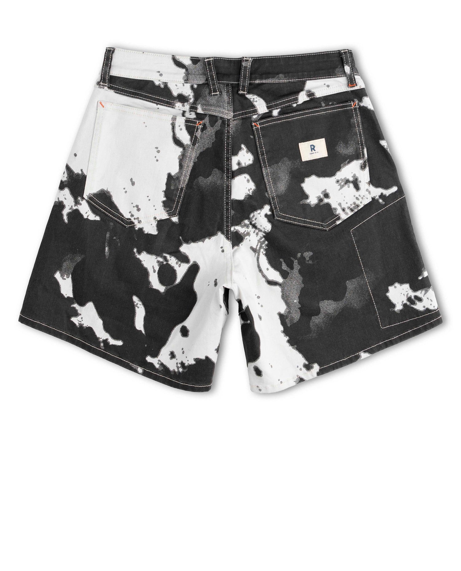 Black and white patterned shorts on a white background