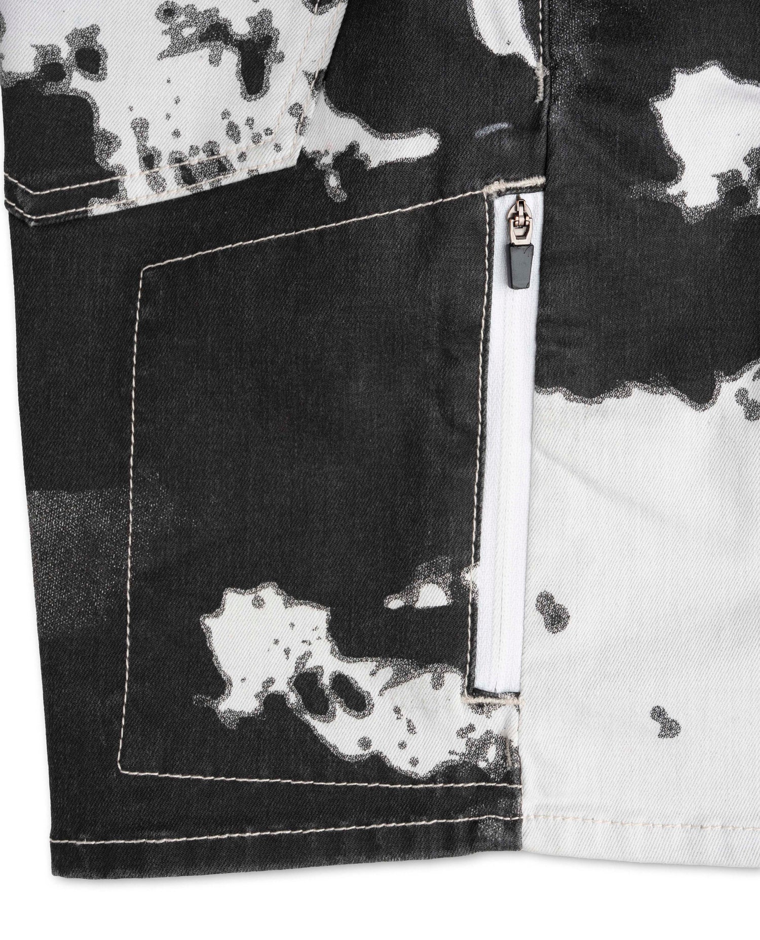 Black and white patterned shirt with a pocket detail on a white background