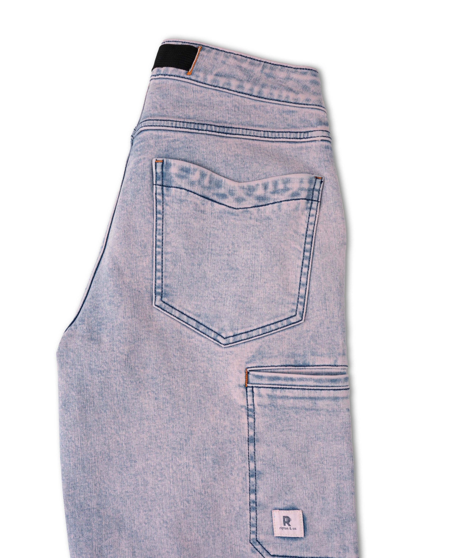 Light blue denim jeans with a brand label on a white background