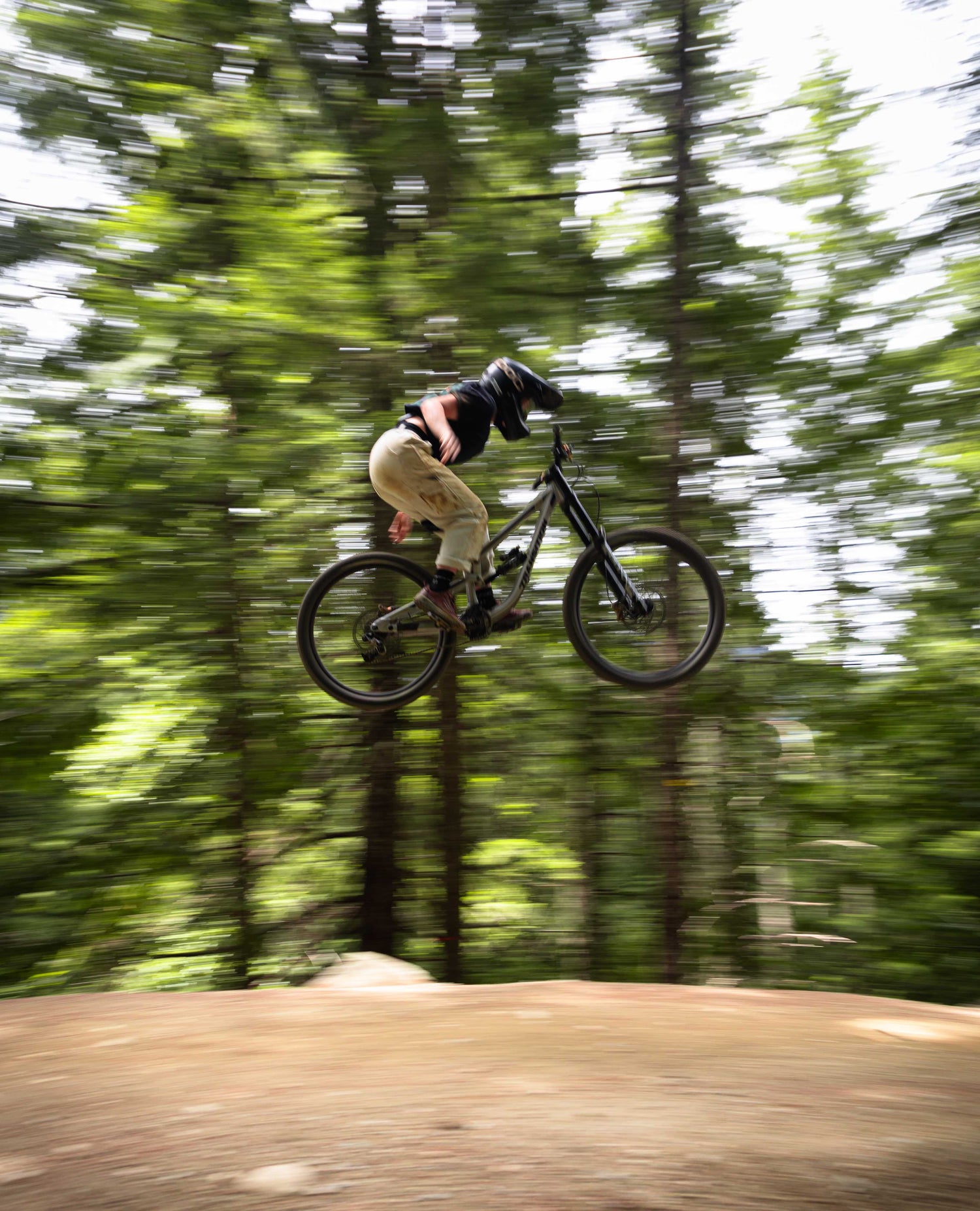 woman in white sport utility pants riding mountain bikes