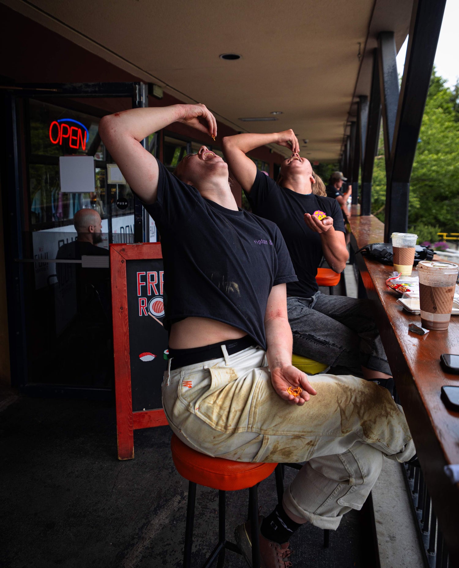 two women eating in white sport utility pants