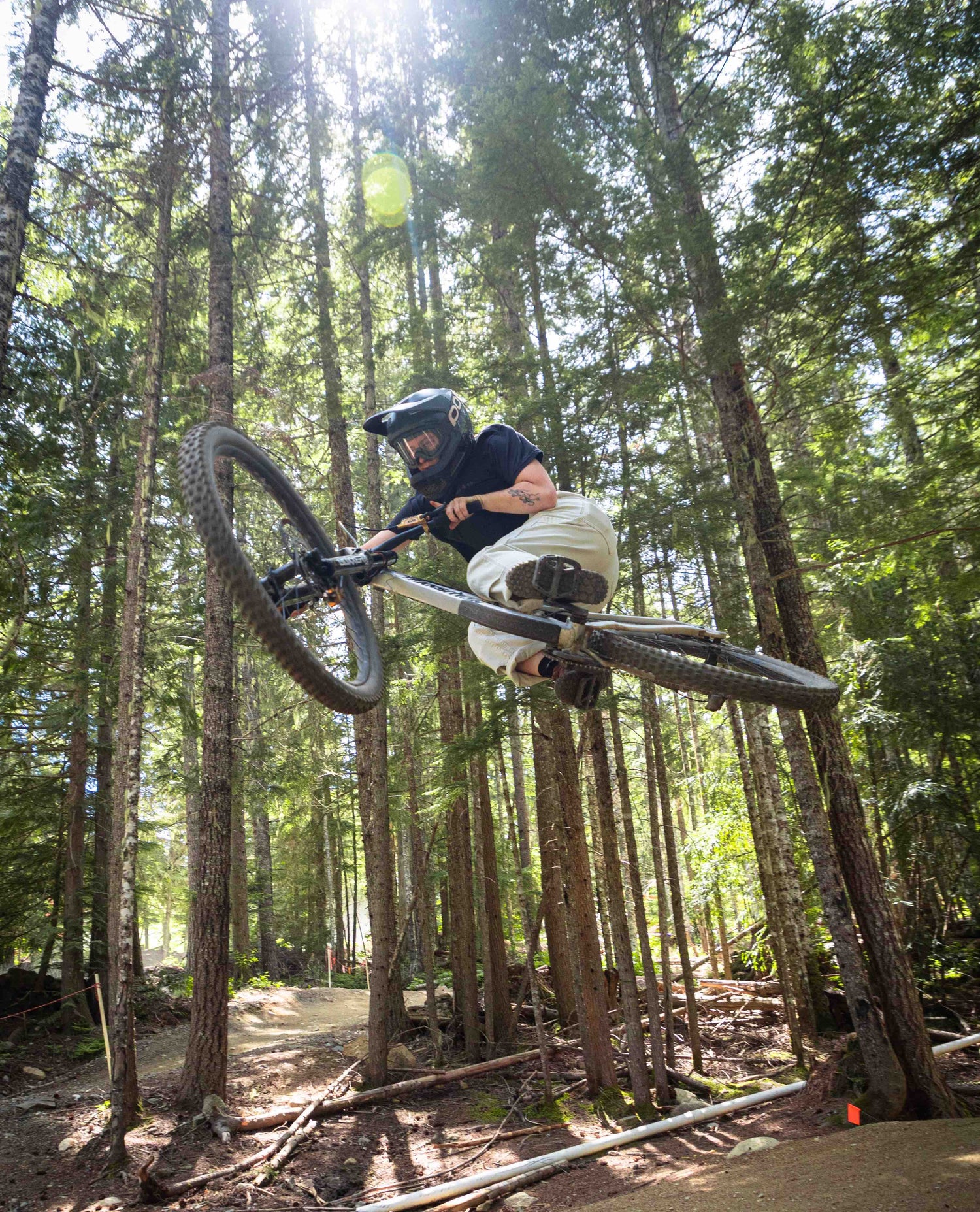 woman in white sport utility pants riding mountain bikes