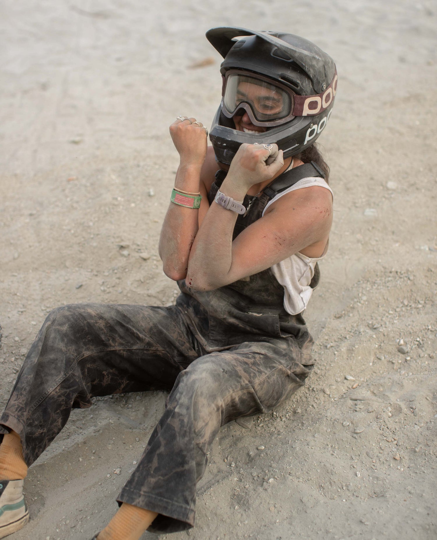 Ari in the dirt in overalls