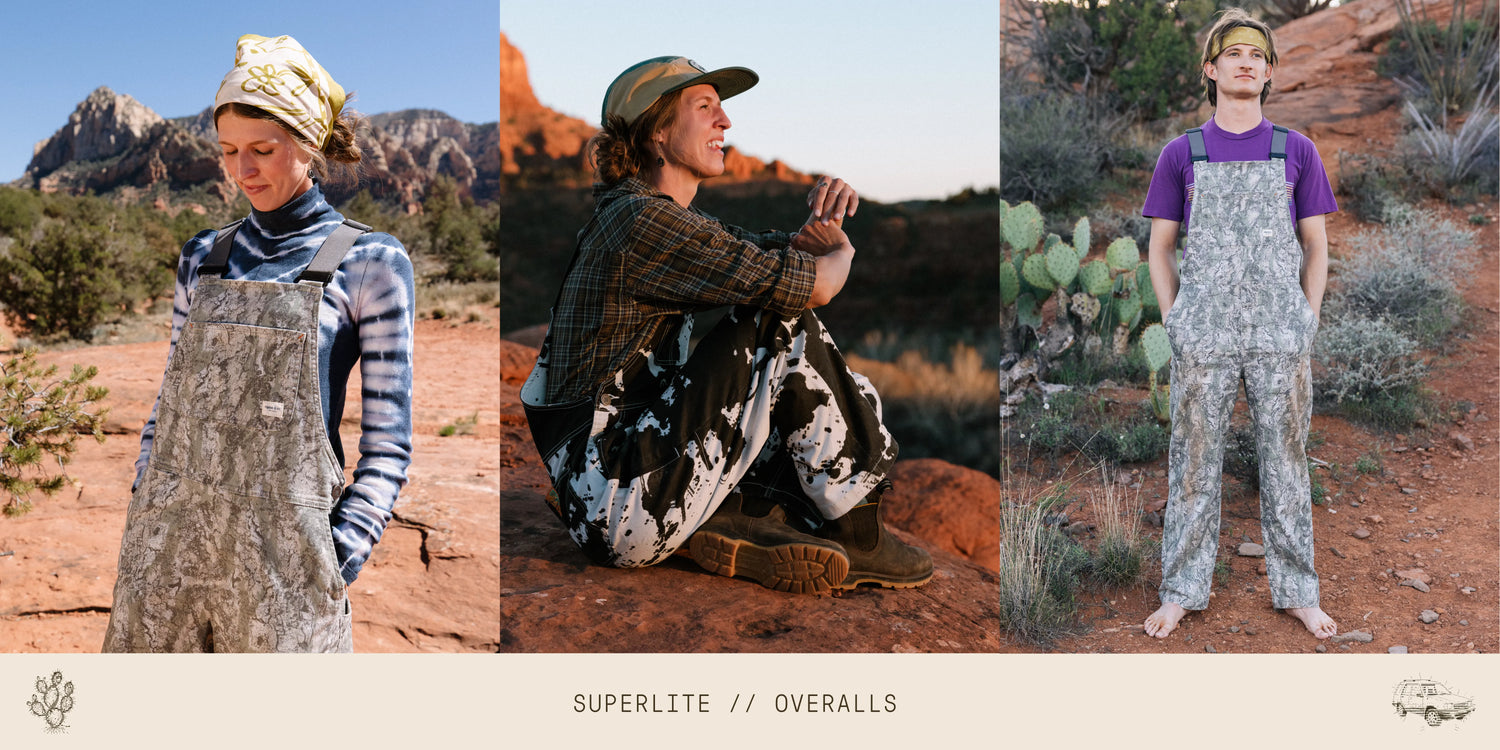 Three people wearing Superlite overalls in a desert setting.