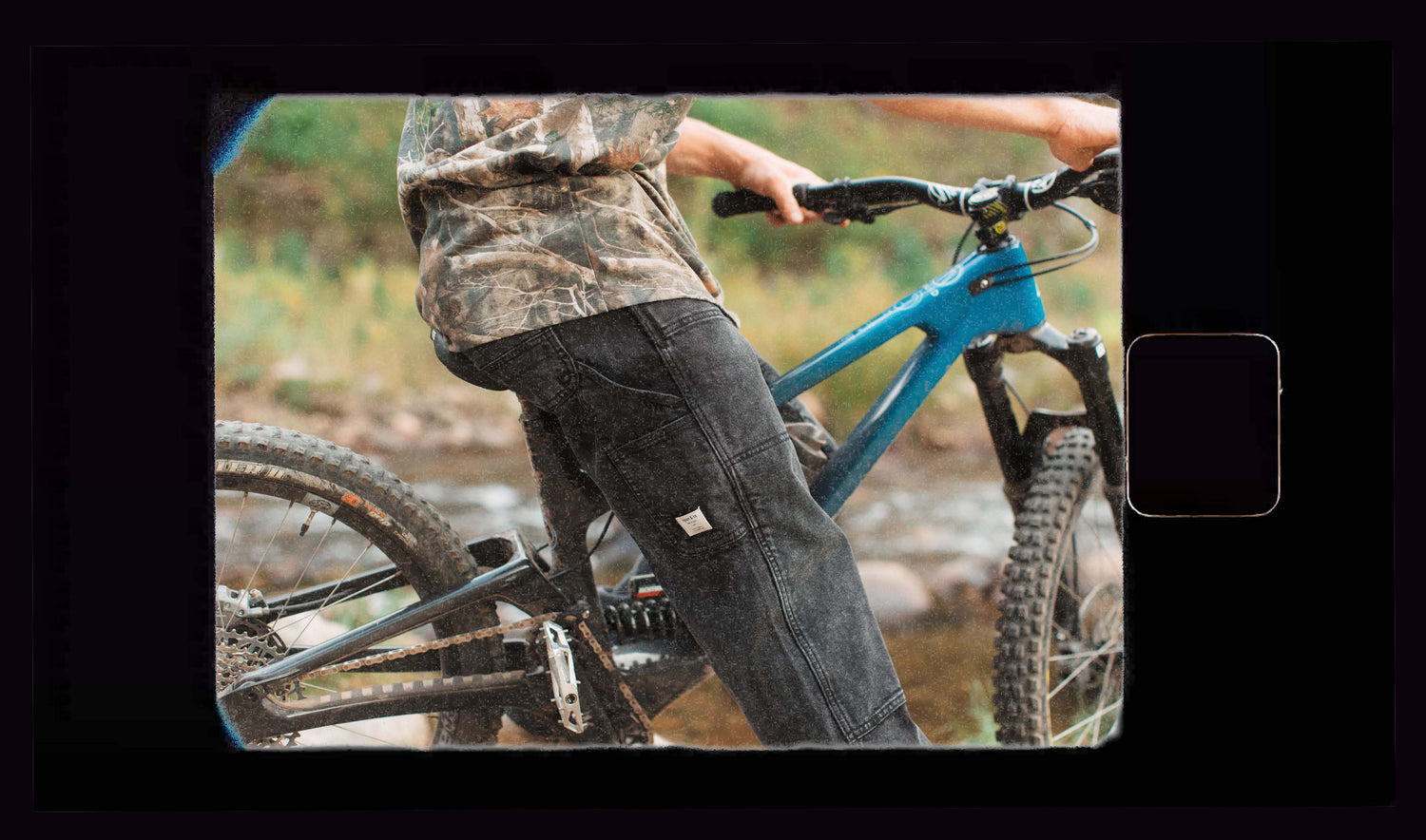Person on a blue mountain bike in a natural setting