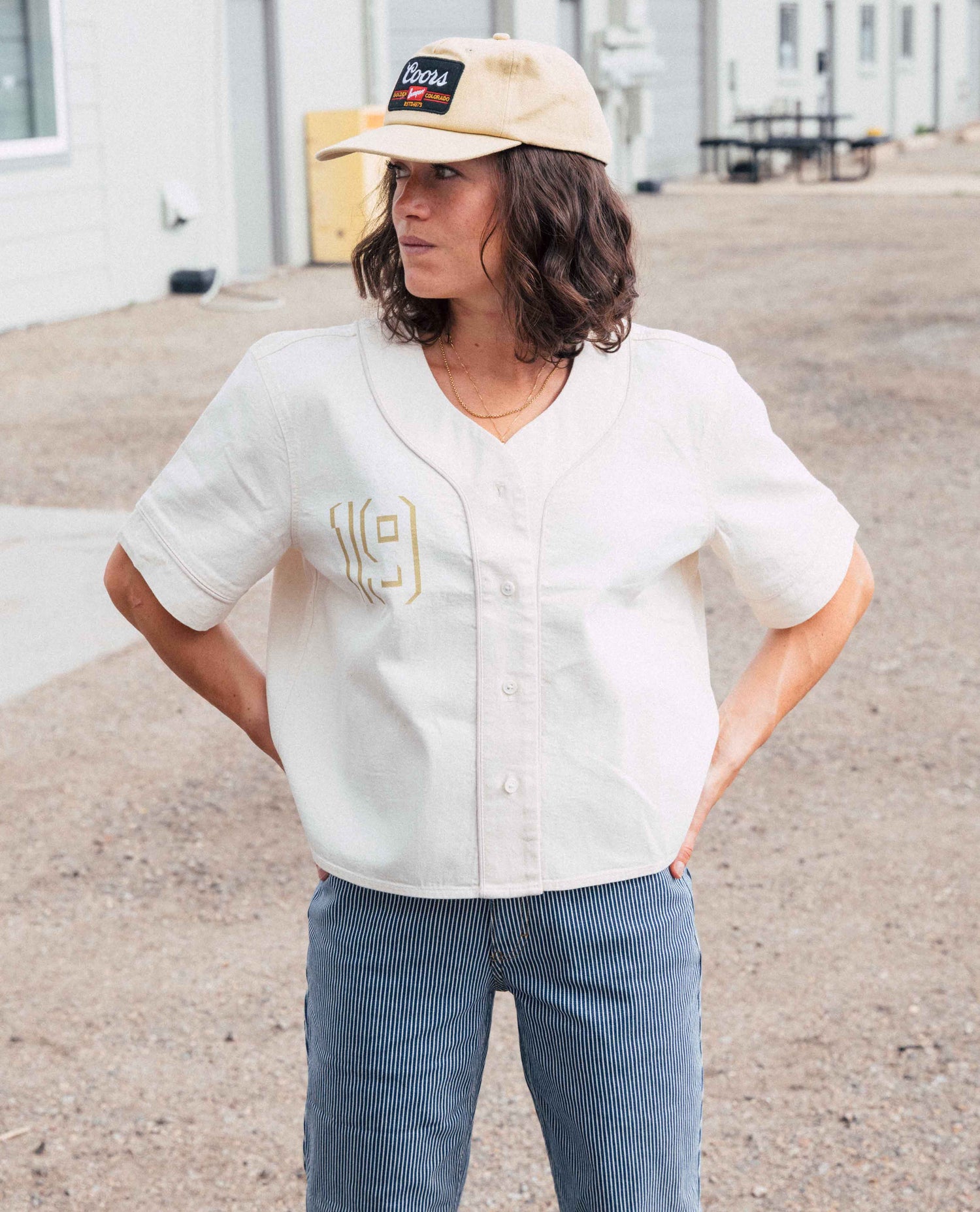 girl named gabby with a a ripton baseball shirt, that is the greatest shirt of all time, that we really suggest you buy, immediately, it's in bone, un dyed white shirt. 