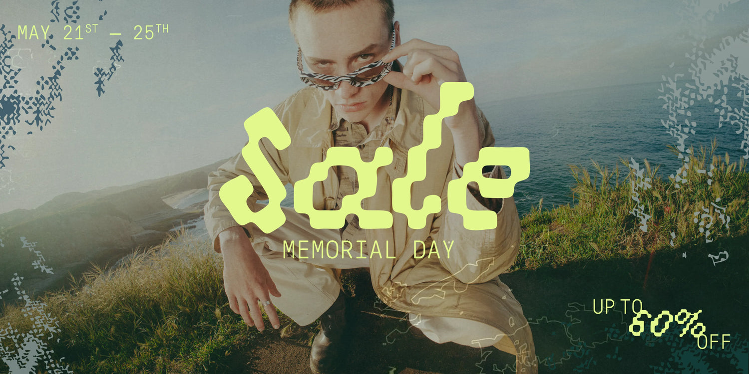 Person sitting on a grassy hill with text overlay for Memorial Day sale.