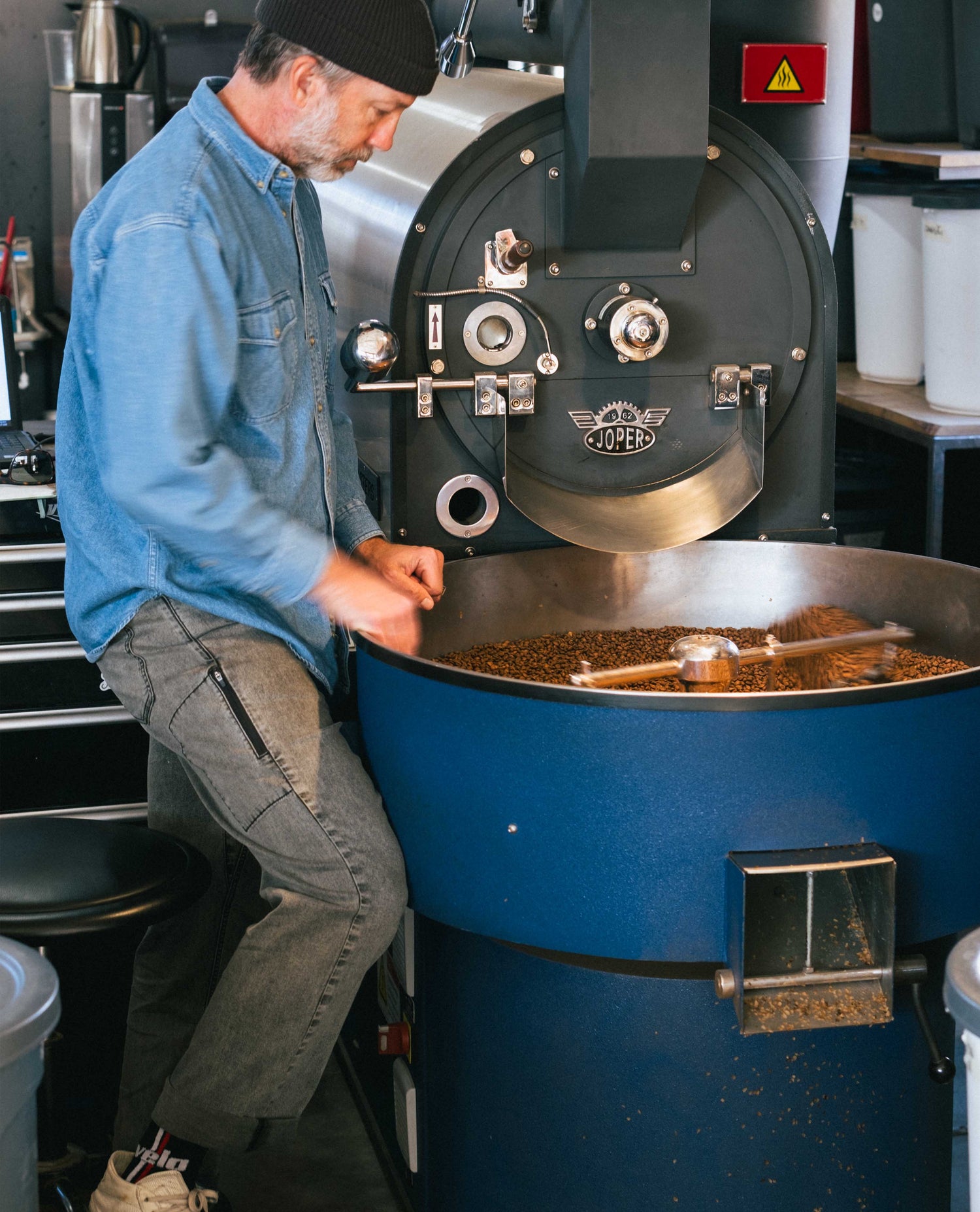 Curtis roasting coffee in superlite jeans